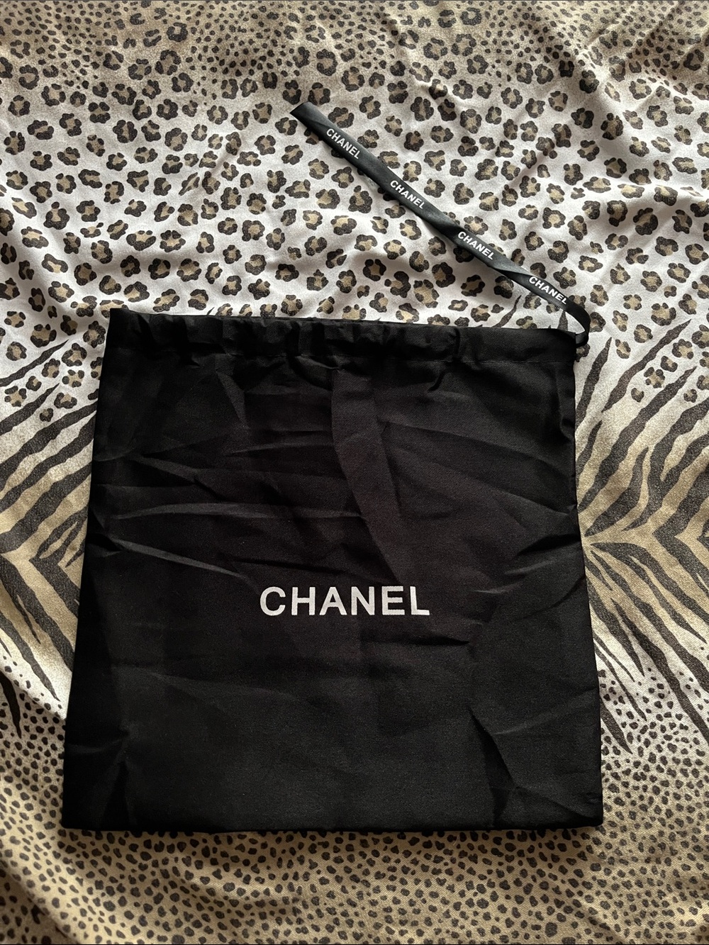CHANEL Black Drawstring Pouch with White Logo
